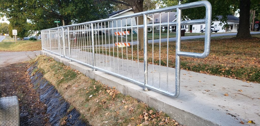 metal barrier placed on a sidewalk